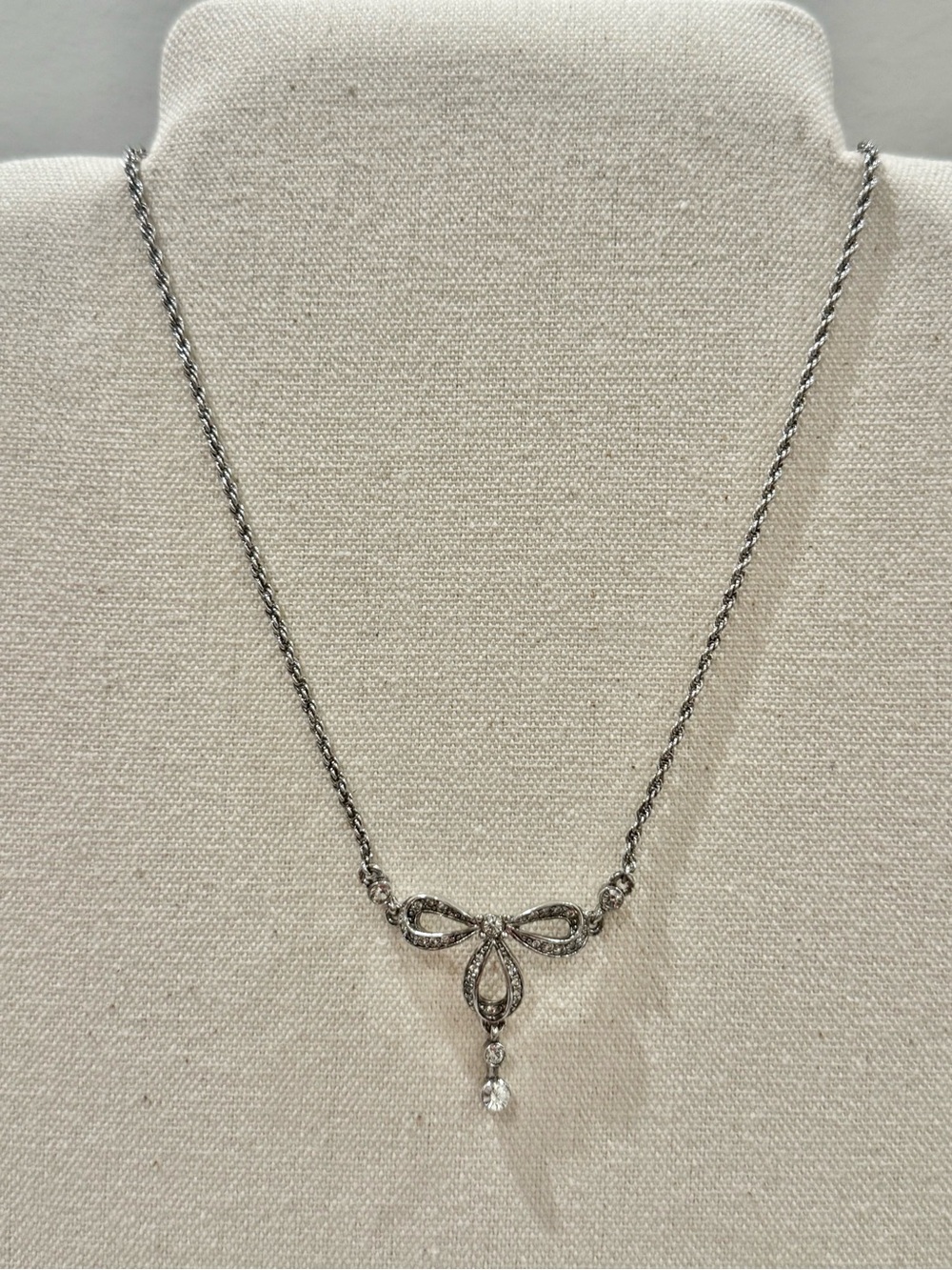 Nina Ricci Silver Bow Pendant Necklace with Crystal Drop